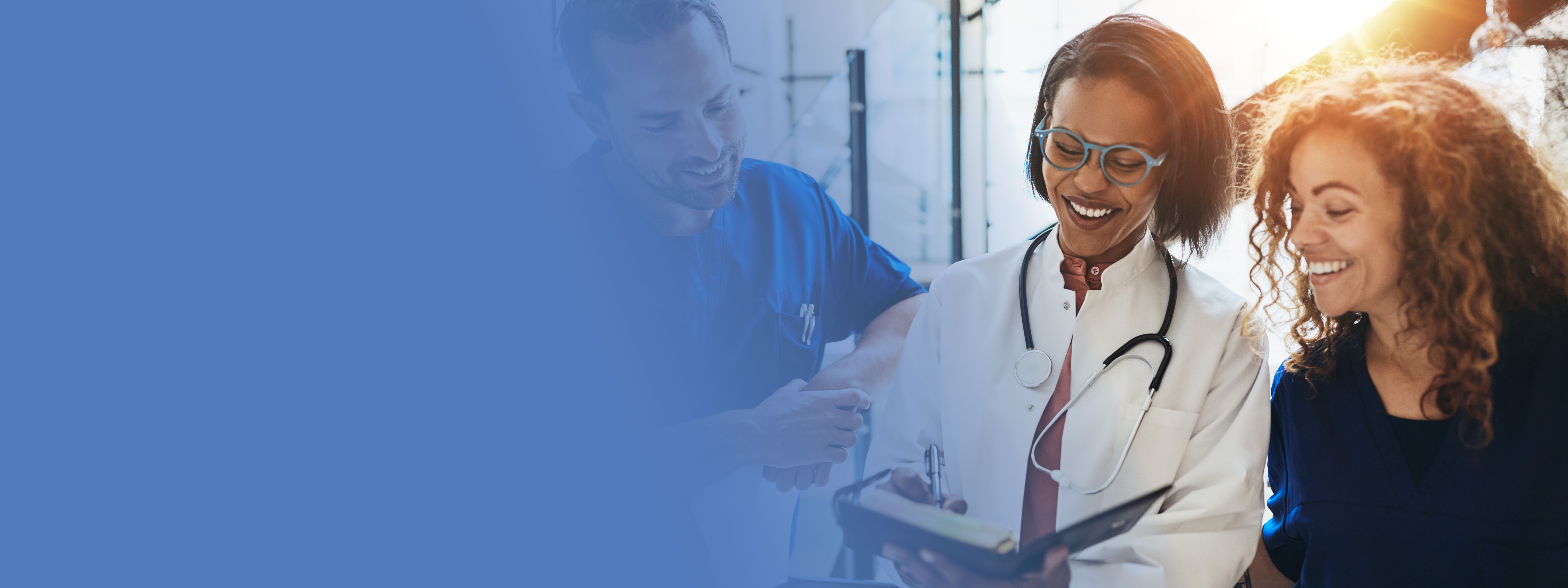 Diverse group of smiling doctors talking together in a hospital